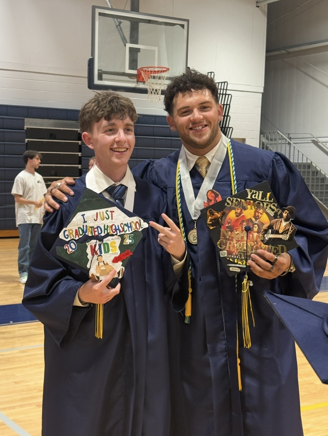 Cam and Noah on graduation day, ready to build C&N