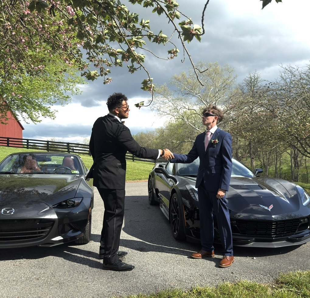 Cam and Noah before the cars that inspired the vision